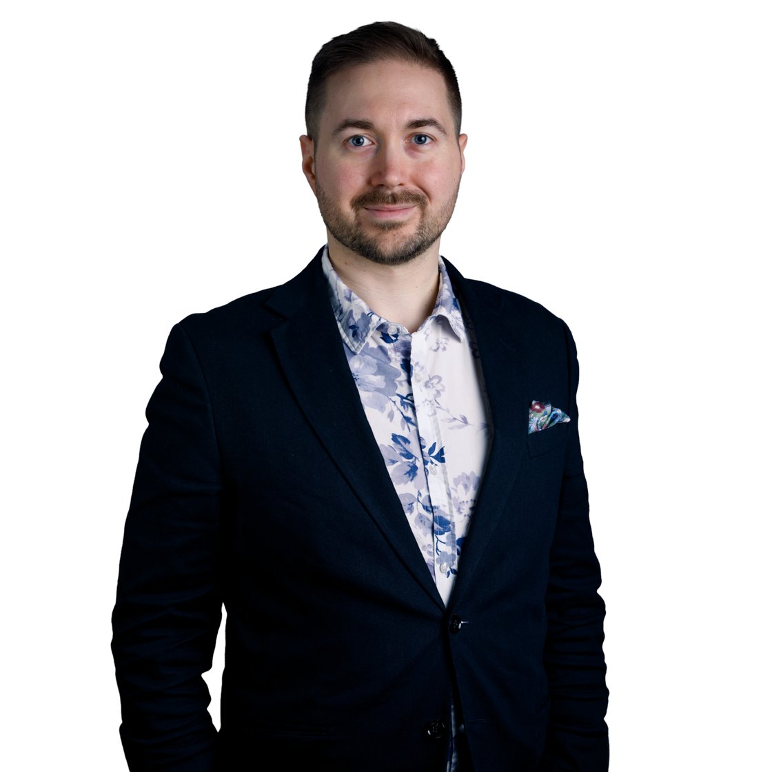 Lauri Lavanti stands in a floral shirt against a white background.