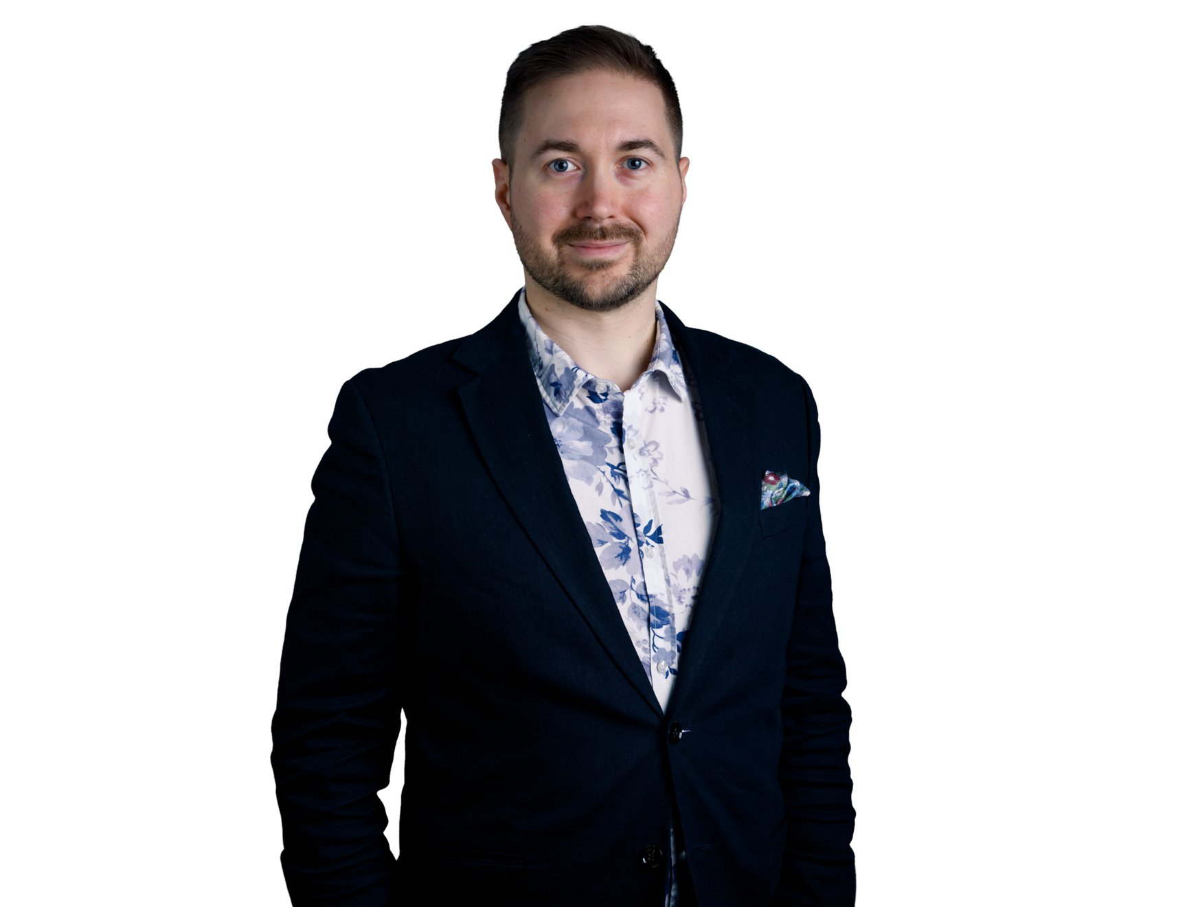Lauri Lavanti stands in a floral shirt against a white background.