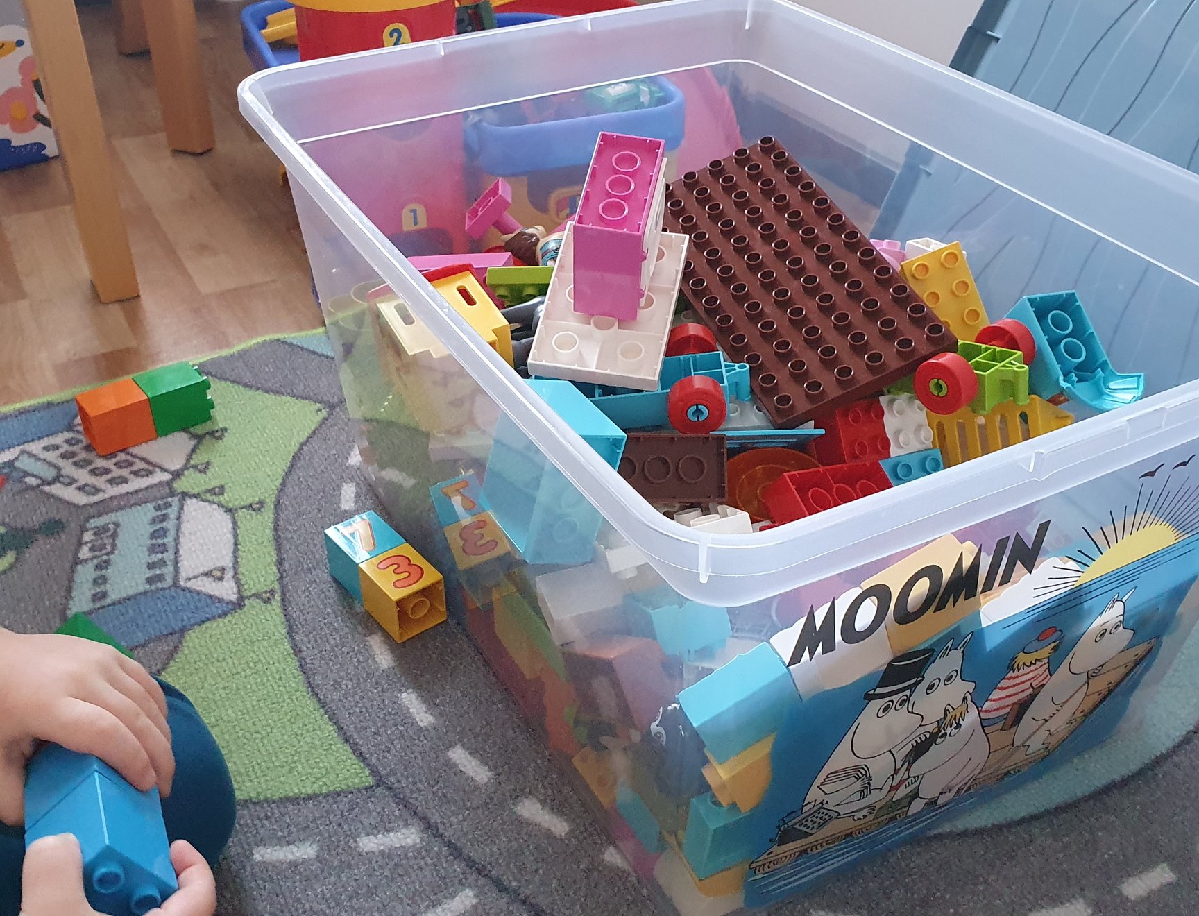 Duplo bricks in a box on top of an automaton.