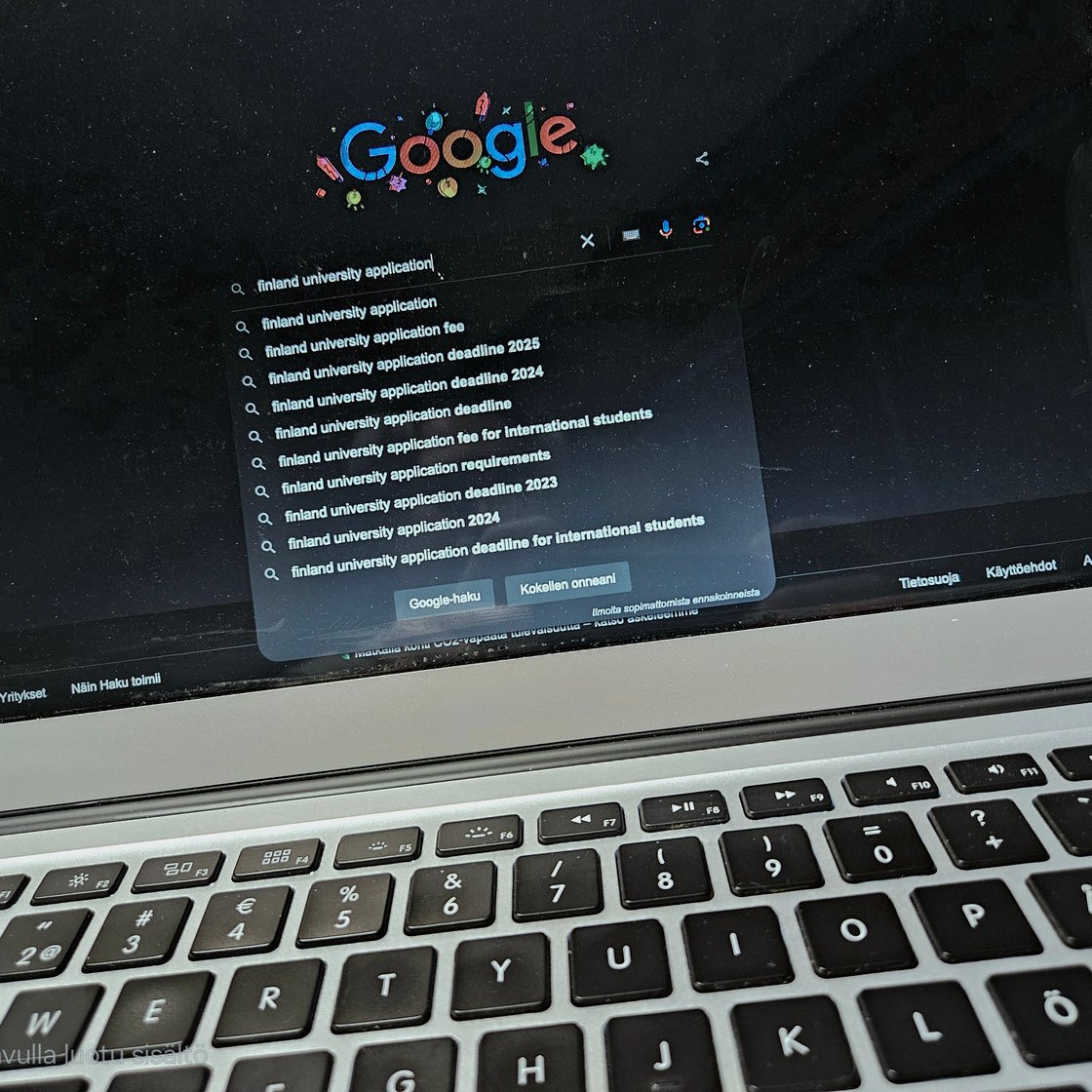 A laptop screen with Google open and the search "Finland university application".
